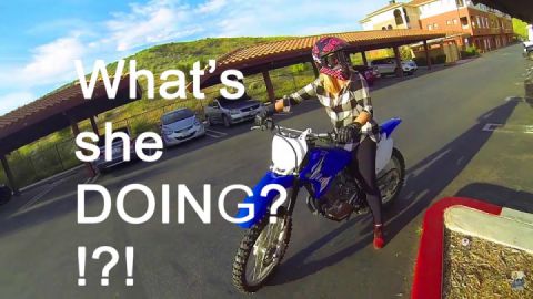 Dirt bike fun. What's she doing?